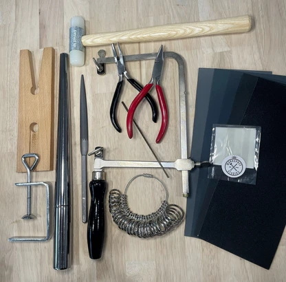 a wooden ring with hand tools
