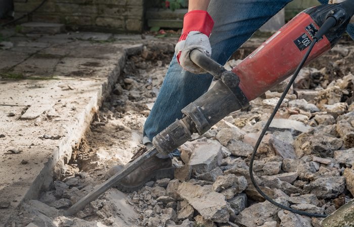 break concrete with red hand tools_1