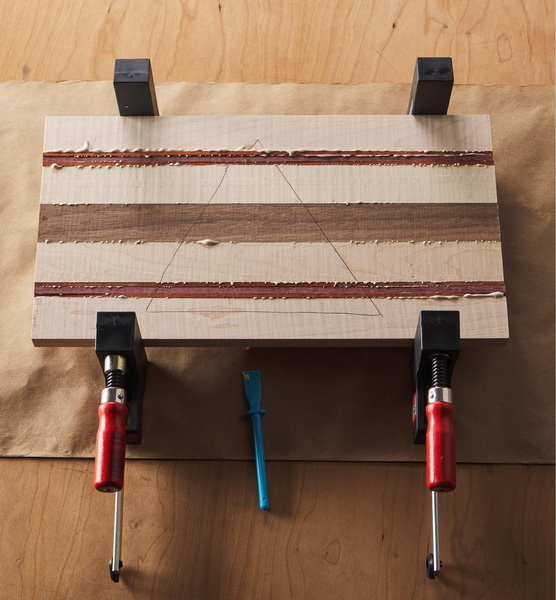a cutting board with hand tools