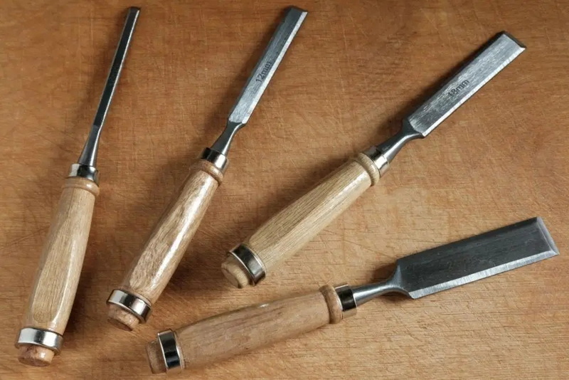 a hole in wood with hand tools