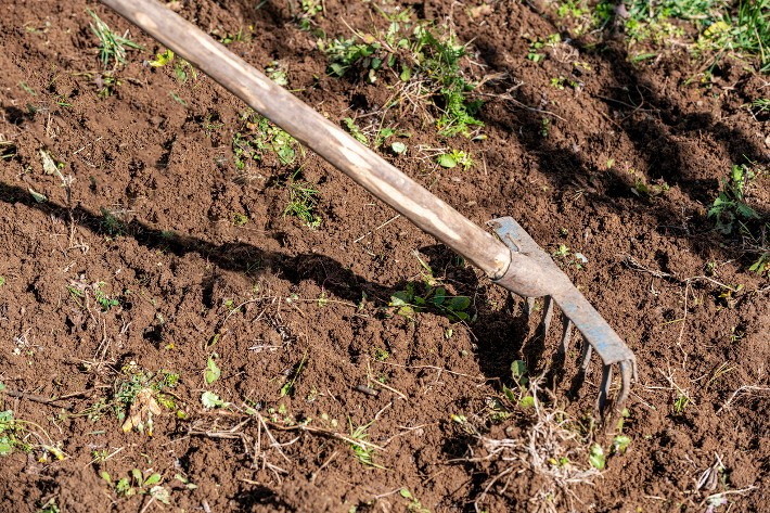 level ground with hand tools